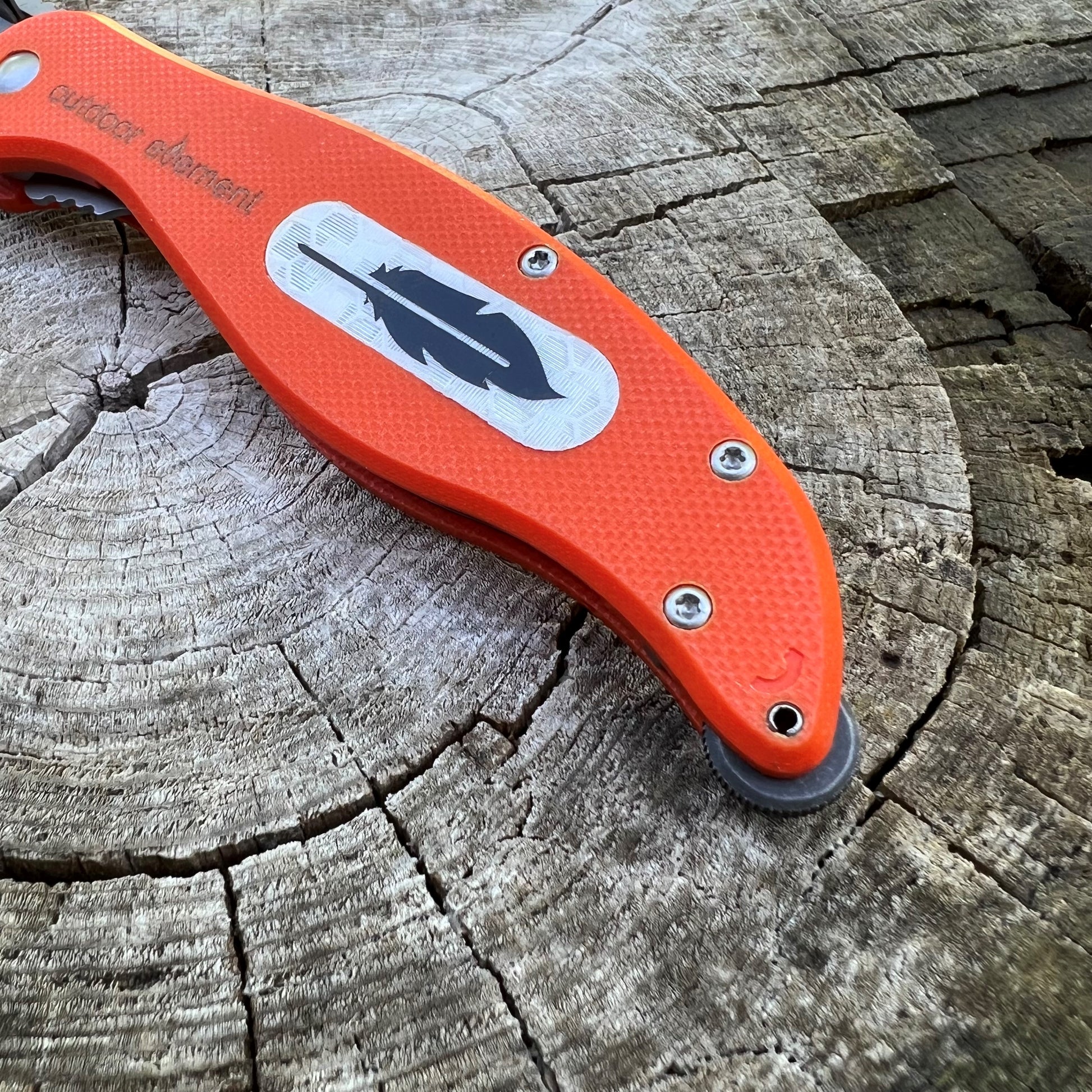 Field Feather knife by outdoor element; integrated EverSpark wheel in the handle provides means to spark fire -- essential for survival and always nice to gather around after a long day's hunt
