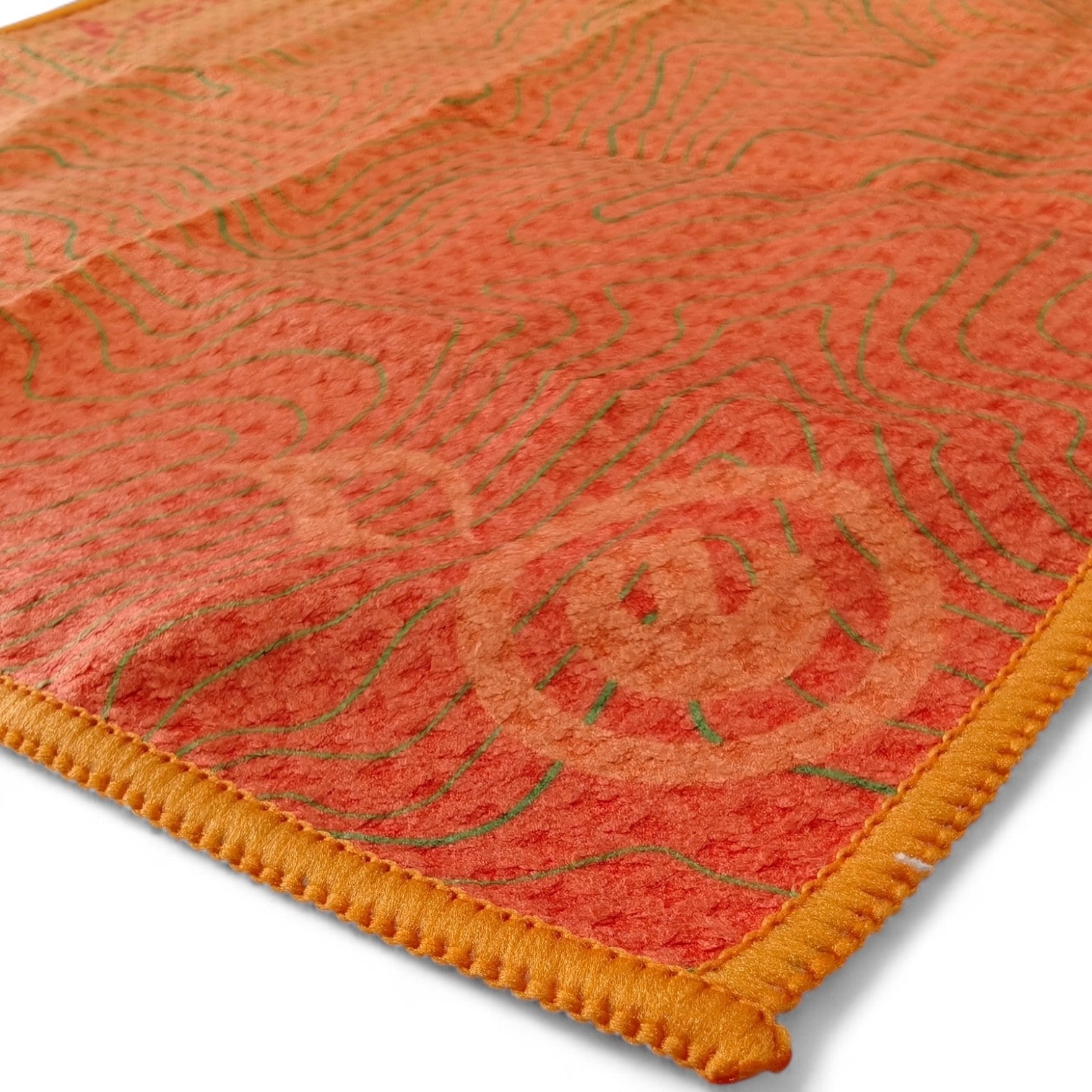 Close-up of a textured orange towel that comes with the scrub n scrape by outdoor element