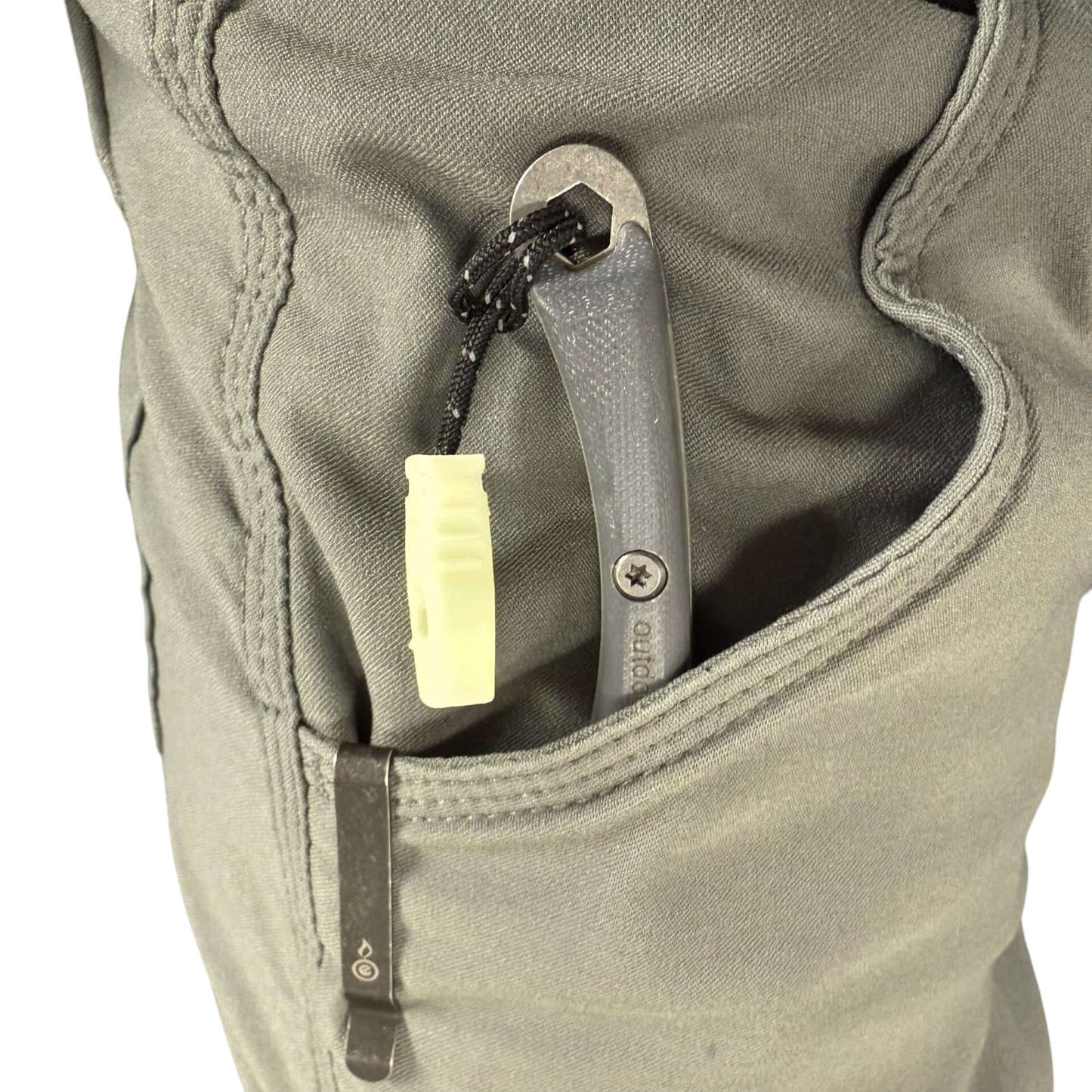 close up of glow feather knife with pocket clip in pocket