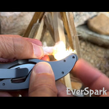 Load image into Gallery viewer, spark fire with the EverSpark Wheel at the butt of the folding feather knife
